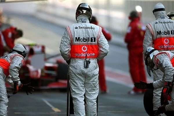 Formula One Testing: Kimi Raikkonen Ferrari F60 makes a pitstop watched by McLaren