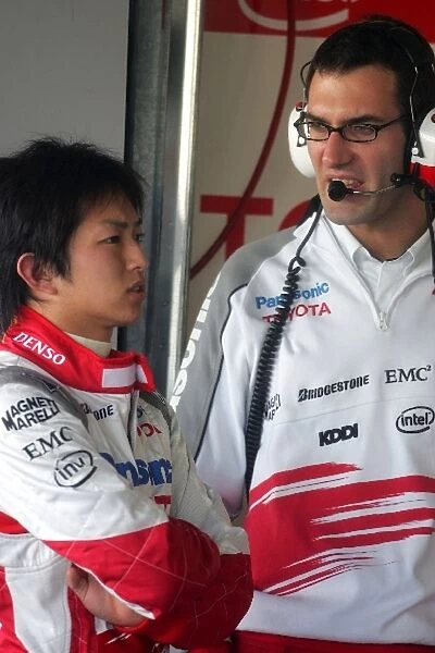 Formula One Testing: Kohei Hirate Toyota TF106 chats to an engineer