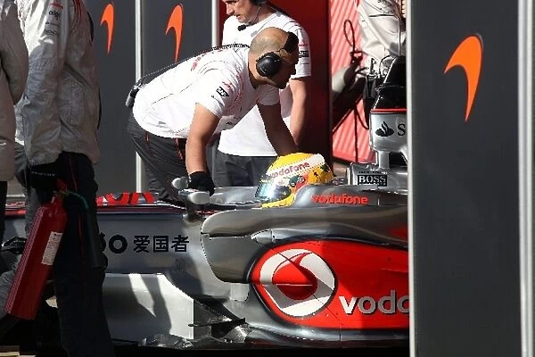 Formula One Testing: Lewis Hamilton McLaren Mercedes MP4  /  23 is pushed back between the screens