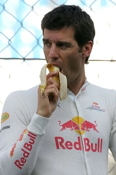 Formula One Testing: Mark Webber Red Bull Racing eats a banana