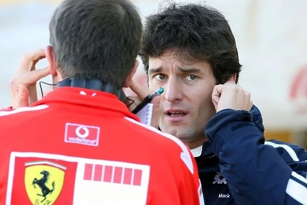 Formula One Testing: Mark Webber Williams chats to a Ferrari engineer