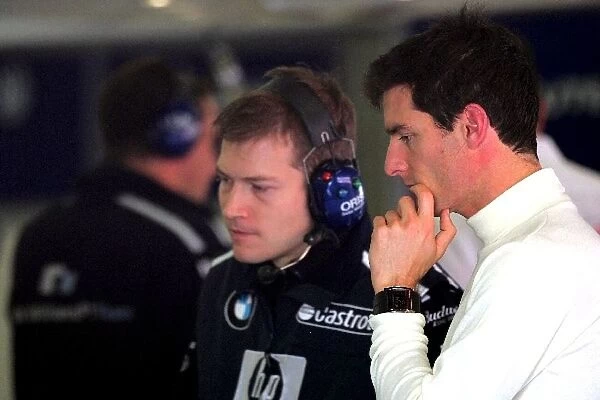 Formula One Testing: Mark Webber Williams talks with an engineer