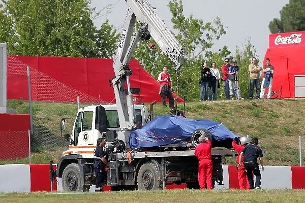 Formula One Testing: Marshals clean up after Sebastien Bourdais crashes the new Scuderia Toro Rosso STR03