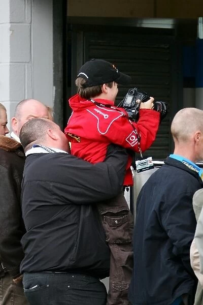 Formula One Testing: Max Sutton, son of Sutton Motorsport Images CEO Keith Sutton, takes photographs at Silverstone