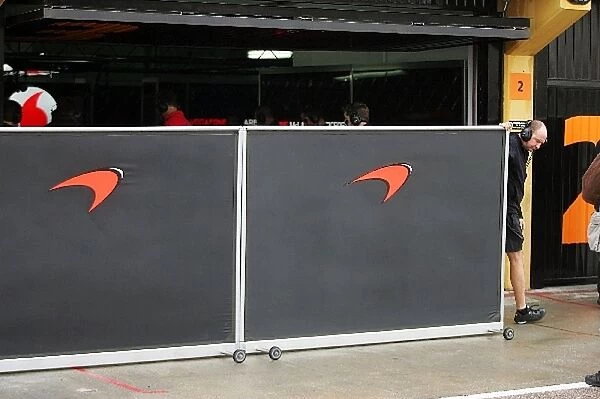Formula One Testing: McLaren put the barriers up outside the garage