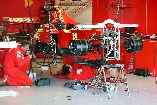 Formula One Testing: Mechanics at work on a Ferrari F2008