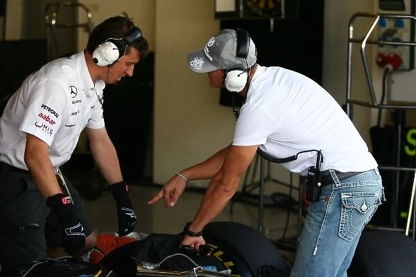 Formula One Testing: Michael Schumacher Mercedes GP with Pirelli tyre engineer