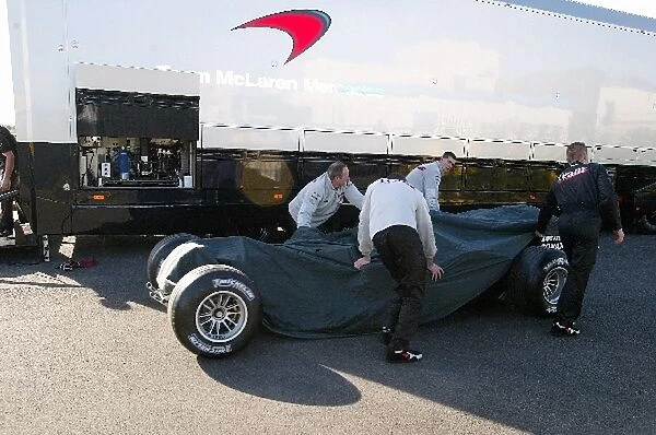 Formula One Testing: The new McLaren MP4  /  18 is unloaded from a truck prior to its debut test