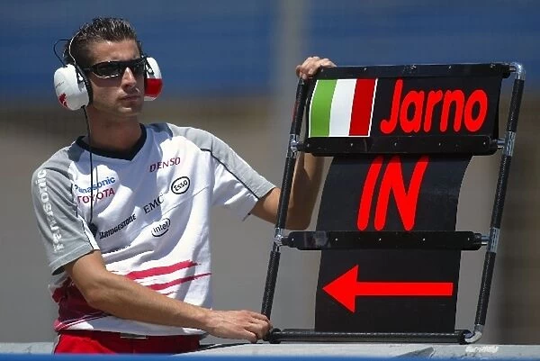Formula One Testing: Pitboard mechanic for Jarno Trulli Toyota