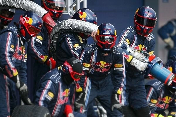 Formula One Testing: Red Bull mechanics practice a pitstop