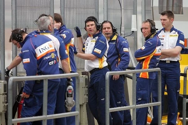 Formula One Testing: Renault mechanics watch the new car being put through its paces