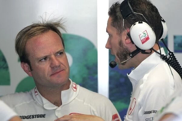 Formula One Testing: Rubens Barrichello Honda speaks with an engineer