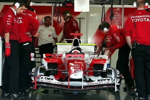 Formula One Testing: Toyota engineers in the garage with the Toyota TF105