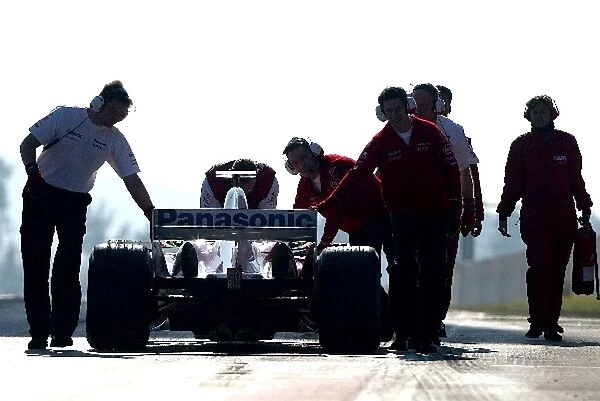 Formula One Testing: The Toyota Team recover their stranded car