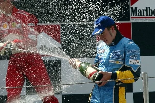 Formula One World Championship: 2nd place finisher Fernando Alonso Renault on the podium