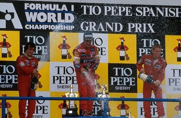 Formula One World Championship: 2nd placed Alain Prost. Winner Nigel Mansel. 3rd place Stefan Johansson
