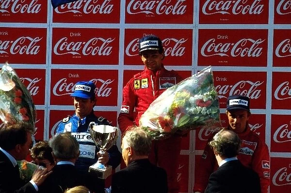 Formula One World Championship: 2nd placed Derek Warwick. Winner Michele Alboreto. 3rd placed Rene Arnoux