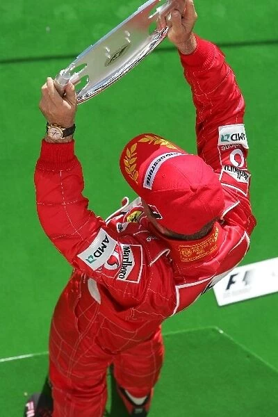 Formula One World Championship: 2nd placed Rubens Barrichello Ferrari with his trophy