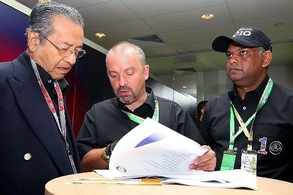 Formula One World Championship: Abdullah Ahmad Badani Malaysian Prime Minister with Mike Gascoyne and Tony Fernandes CEO of Air Asia and Team
