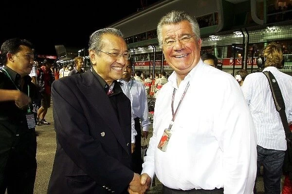 Formula One World Championship: Adbdullah Ahmad Badani Malaysian Prime Minister shakes hands with Philippe Gurdjian