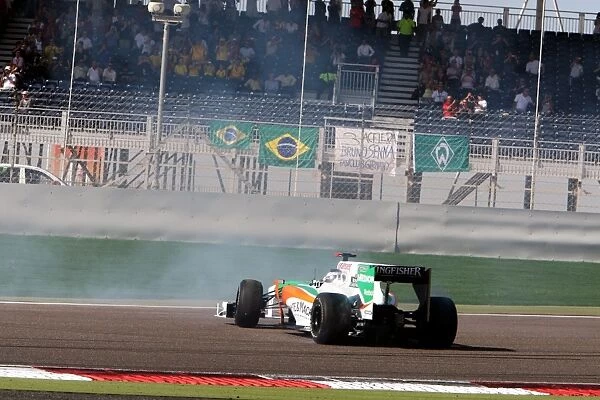 Formula One World Championship: Adrian Sutil Force India F1 VJM03 recovers to the track at the start of the race
