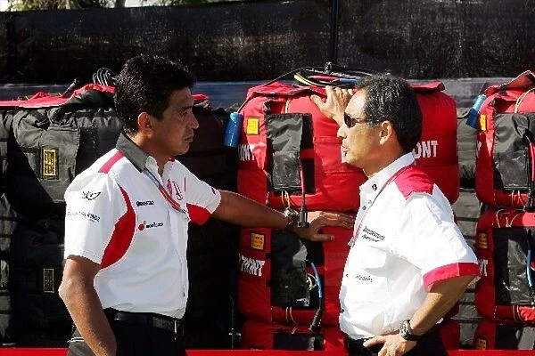 Formula One World Championship: Aguri Suzuki Team Principal Super Aguri F1 talks with Hiroshi Yasukawa Bridgestone Director of Motorsport