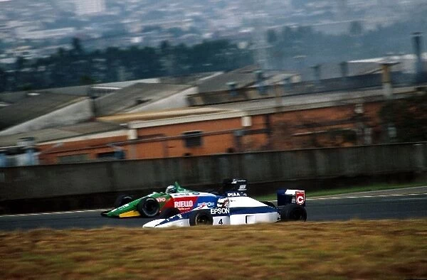 Formula One World Championship: Alessandro Nannini Benetton Cosworth B190 battles with Jean Alesi Tyrrell Cosworth 018