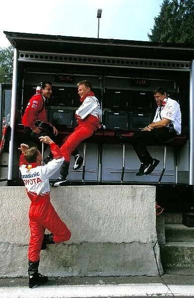 Formula One World Championship: Allan McNish, left, gesticulates to Toyota team mate Mika Salo on the pit wall