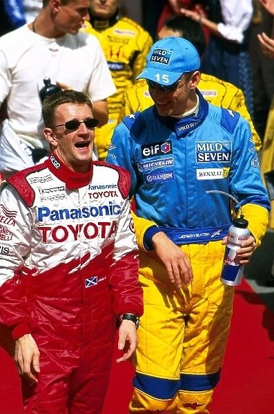 Formula One World Championship: Allan McNish Toyota, left, shares a joke with Jenson Button, Renault, right