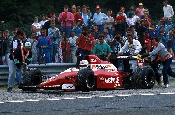 Formula One World Championship: Andrea de Cesaris and Pierluigi Martini clashed, stopping the race