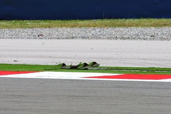 Formula One World Championship: Astroturf lifted from the exit of turn 1 red flagged the session
