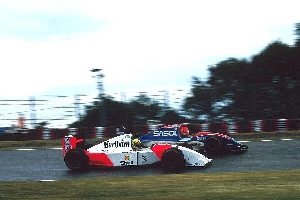 Formula One World Championship: Ayrton Senna McLaren Ford MP4  /  8 passes Eddie Irvine Jordan Hart J193 on the way to the win