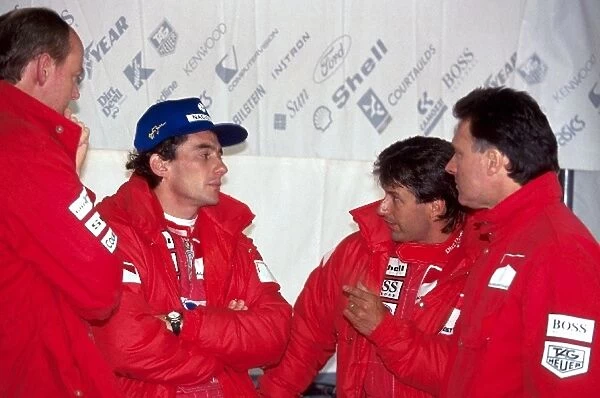 Formula One World Championship: Ayrton Senna McLaren speaks with his engineers and Michael Andretti McLaren