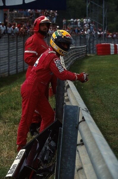 Formula One World Championship: Ayrton Senna watches the action after retiring with hydraulic problems