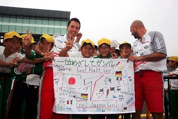 Formula One World Championship: Banner of support for Toyota by young children