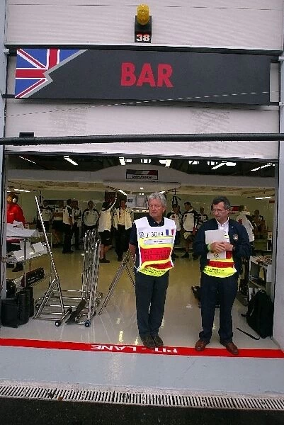 Formula One World Championship: BAR mechanics amuse themselves during the session as their cars await their unimpounding