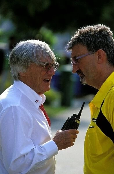 Formula One World Championship: Bernie Ecclestone, left, chats to Jordan team owner Eddie Jordan