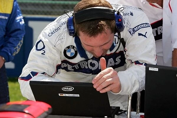 Formula One World Championship: A BMW mechanic works on the grid
