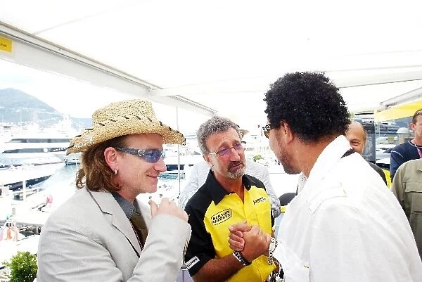 Formula One World Championship: Bono lead singer U2 with Eddie Jordan Jordan Team Owner and Lionel Richie singer