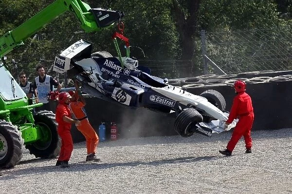 Formula One World Championship: The car of Antonio Pizzonia Williams BMW FW26 is removed after he crashed at Parabolica