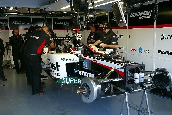 Formula One World Championship: The car of Nicolas Kiesa Minardi Cosworth PS03 in the garage