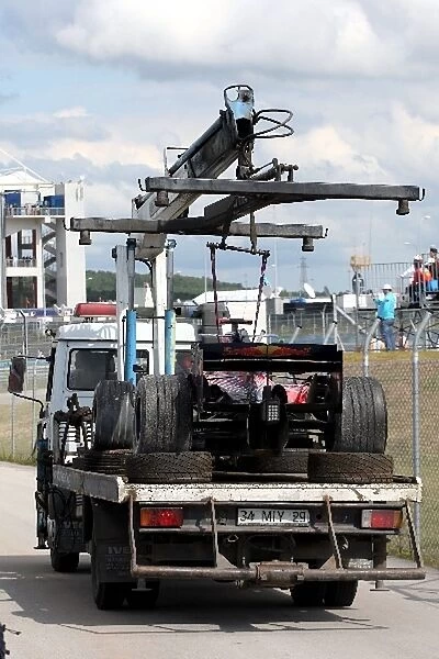 Formula One World Championship: The car of Sebastien Bourdais Scuderia Toro Rosso STR02 on a truck after spinning