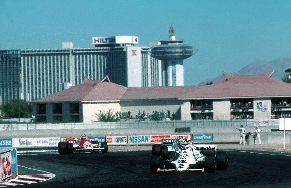 Formula One World Championship: Carlos Reutemann Williams FW07C, leads Nelson Piquet, Brabham BT49C