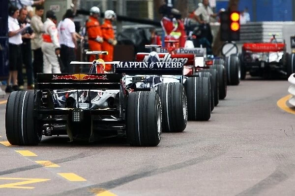 Formula One World Championship: Cars at the end of the pit lane during qualifying