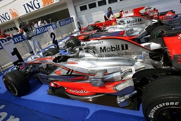 Formula One World Championship: The cars of Heikki Kovalainen McLaren, Lewis Hamilton McLaren and Felipe Massa Ferrari in parc ferme after qualifying