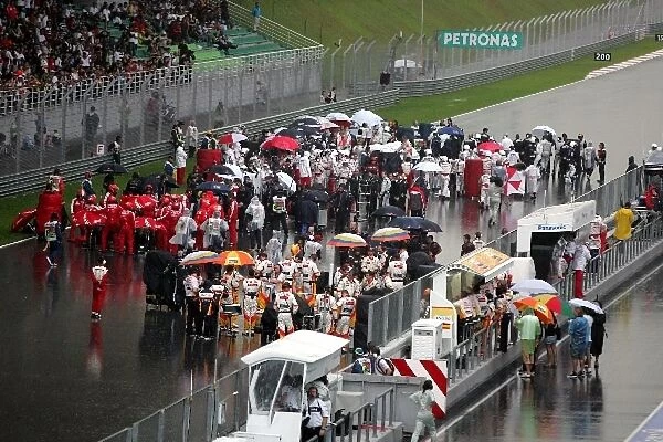 Formula One World Championship: The cars line up on the grid after the race was suspended due to torrential rain