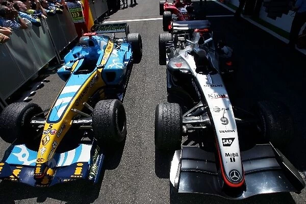 Formula One World Championship: The cars of Race winner Fernando Alonso Renault and Kimi Raikkonen McLaren in parc ferme