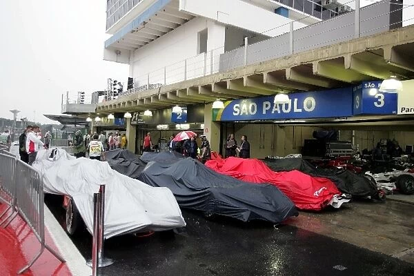 Formula One World Championship: Cars in a very wet parc ferme after the race