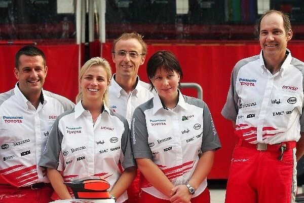 Formula One World Championship: The caterers at the team photograph