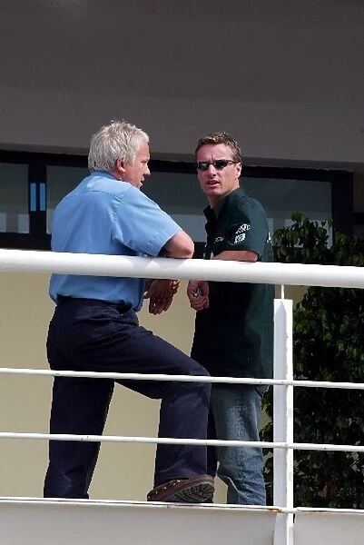 Formula One World Championship: Charlie Whiting FIA Race Director talks with Eddie Irvine Jaguar
